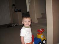 112-Kenny_laughs_at_Mommy_with_the_pumpkin_on_her_head