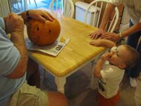 114-Kenny_tries_to_eat_some_of_the_pumpkin