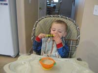 08-Kenny_eats_cereal_with_the_truck_spoon