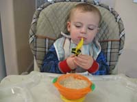 09-Kenny_eats_cereal_with_the_truck_spoon