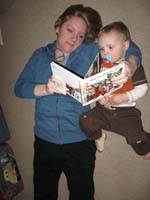 09-Mommy_reading_to_Kenny_on_the_floor