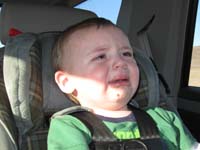 105-even_with_a_snack_he's_still_really_sick_of_being_in_the_car