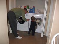 56-Kenny_helping_Daddy_with_the_laundry