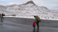 059-Mommy_shows_Kenny_how_to_stomp_his_feet_to_get_the_snow_off