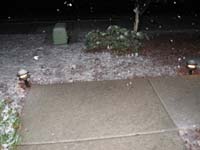 089-snow_covered_front_yard_and_ice_on_sidewalk-526pm