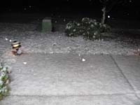 090-snow_covered_front_yard_and_slush_on_sidewalk-830pm