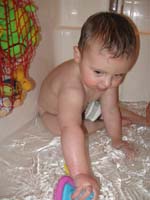 140-Kenny_playing_with_his_new_bath_toys