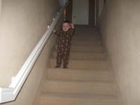 14-Kenny_walking_down_the_stairs