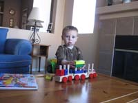 17-Kenny_playing_with_the_stacking_train