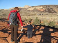 37-Mommy_and_Kenny_on_petrified_dunes_with_old_lava_flowing_over_sandstone