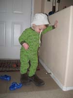 03-Kenny_puts_on_Daddy's_shoes_and_Kenny's_hat