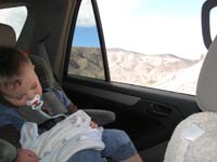 39-Kenny_fast_asleep_as_we_travel_the_dirt_road