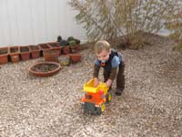 19-Kenny's_playing_in_the_backyard_just_before_it_starts_to_rain