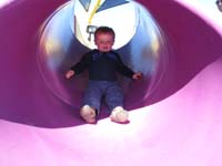 07-Kenny_in_a_purple_tunnel_slide