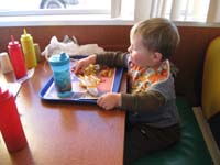 73-Kenny_sits_like_a_big_boy-corn_dog_nuggets_and_fries_with_KETCHUP