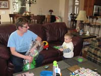 04-Grammy_helps_Kenny_open_his_Easter_basket
