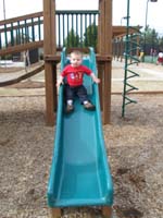 10-Kenny_on_the_slide_in_the_park_in_Grammy's_neighborhood