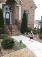22-Kenny_in_front_of_the_house