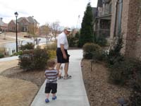 24-Kenny_helping_Grampa_Duke_put_garden_tools_away