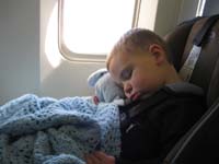56-Kenny_falls_asleep_30_minutes_before_we_land