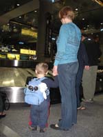 57-Kenny_and_Mommy_wait_for_luggage