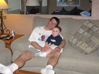03-Kenny_is_very_tired-he_relaxes_in_Daddy's_lap_while_watching_Blue's_Clues