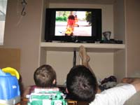 12-Kenny_and_Daddy_relaxing_watching_a_children's_music_video_about_trucks_on_Noggins