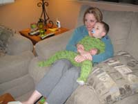 18-Kenny_is_really_tired_relaxing_in_Mommy's_arms_on_the_couch