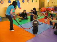 15-Kenny_holds_the_ring_of_colors_with_all_the_other_kids