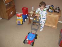 08-Kenny_digs_the_bubble_lawn_mower_from_Baba_and_Grandpa