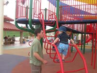 16-Daddy_helping_Kenny_climb_the_curvy_ladder