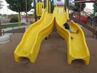 30-Kenny_coming_down_the_slide-down_he_goes