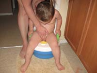 027-Mommy_helps_Kenny_use_the_potty-he's_a_little_too_big_for_it