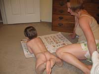 030-naked_Kenny_laying_down_reading