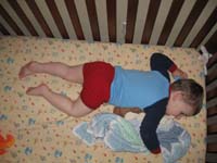 034-big_boy_cuddling_with_his_blanket_and_monkeys_ready_for_night_night