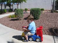 049-Kenny_riding_his_truck_in_community_common_area