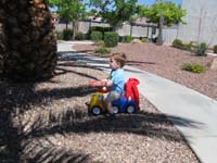 050-Kenny_riding_his_truck_in_community_common_area
