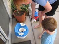 055-Mommy_shows_Kenny_the_poop_is_supposed_to_go_into_the_potty