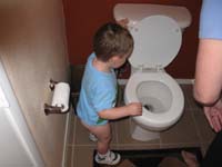 056-Mommy_puts_the_poop_in_the_toilet_and_Kenny_flushes_the_toilet