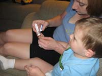057-such_a_good_boy_sitting_there_while_Mommy_cuts_Kenny's_nails