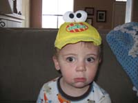 063-for_some_reason_Kenny_wants_to_wear_the_goofy_Sesame_Street_hat