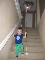04-Kenny_brings_Mommy_a_balloon_on_Mother's_Day