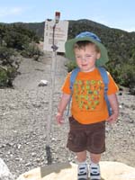 51-Kenny_and_trailhead_sign-someday_Daddy_will_take_him_to_those_peaks