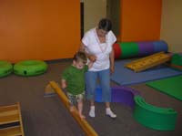 09-Baba_helps_Kenny_on_the_balance_beam