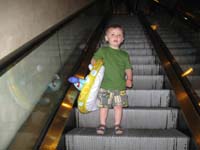 21-he_sees_Mommy_Baba_and_Grandpa_while_coming_down_the_escalator