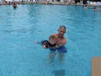 25-Grandpa_helping_Kenny_swim