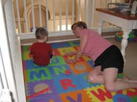67-Kenny_and_Grammy_on_the_letter_mat