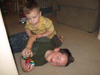 39-Kenny_and_Toby_rough_housing-Toby_gets_beat_up_by_a_two_year_old