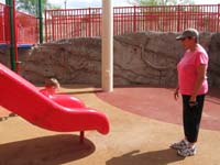 04-Baba_watching_Kenny_ride_down_the_slide