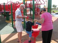 15-Grandpa_and_Baba_help_Kenny_take_big_steps